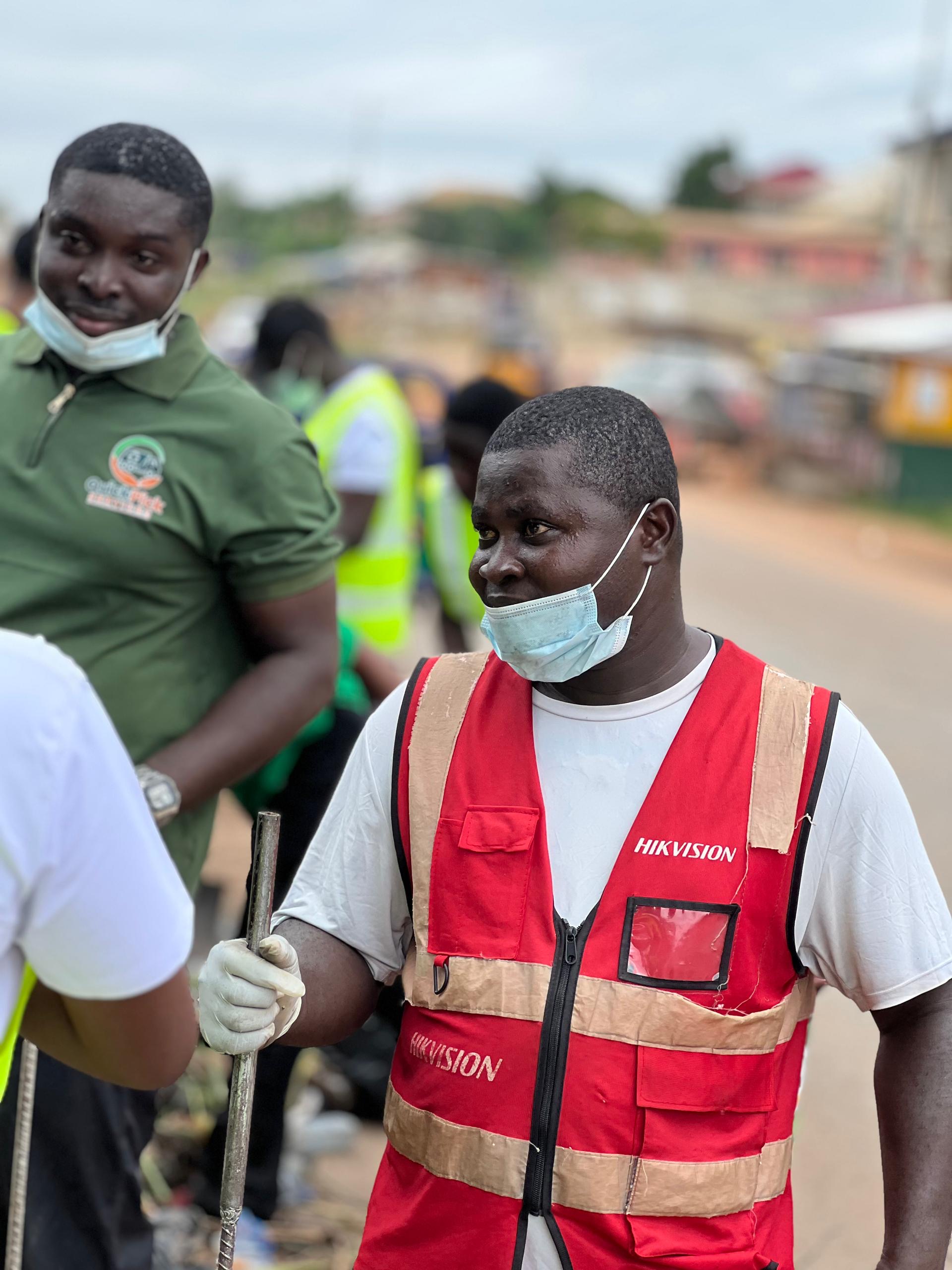 QuickPick supervisor and worker at a community clean-up