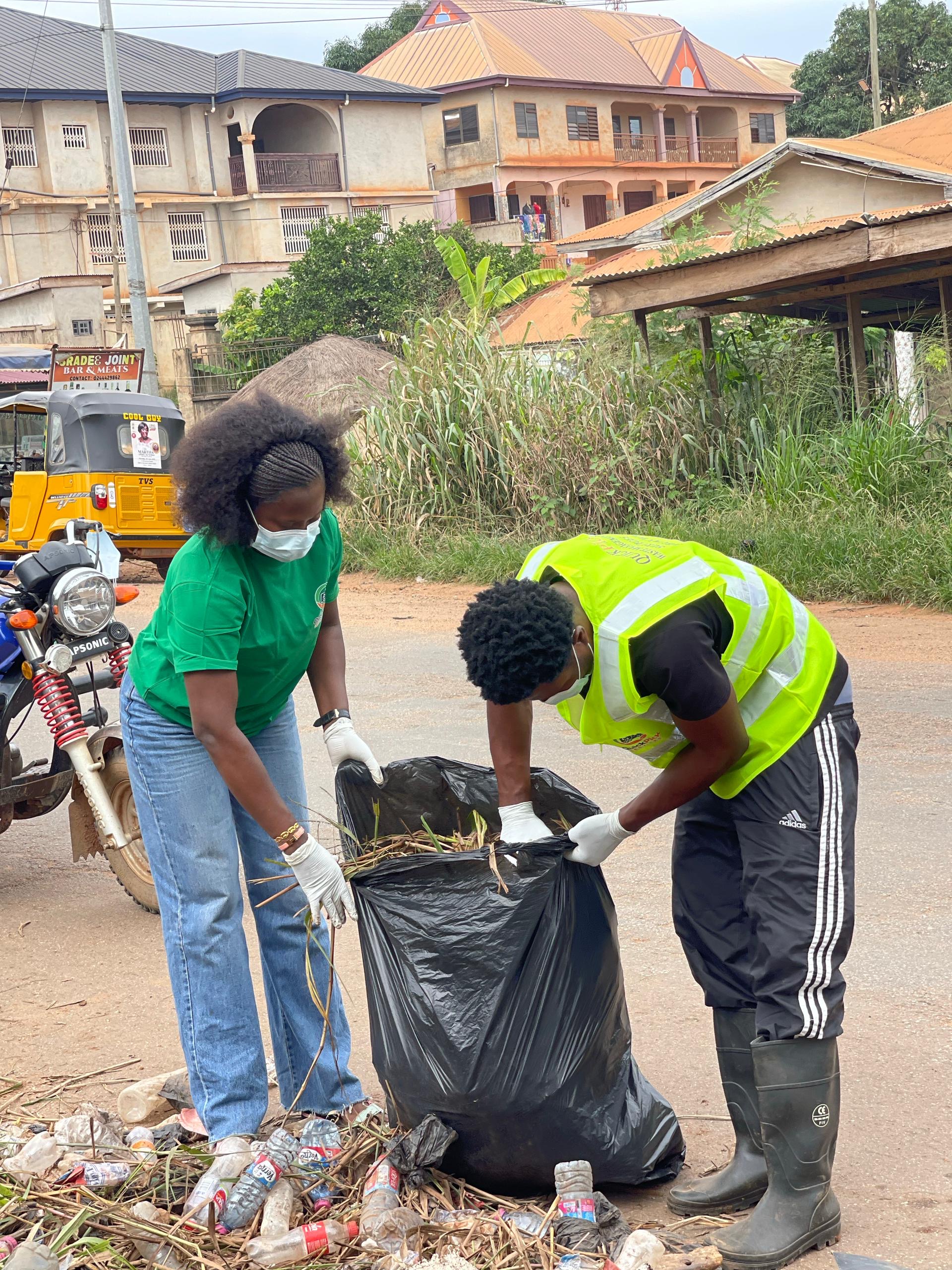 QuickPick team bagging waste at the roadside