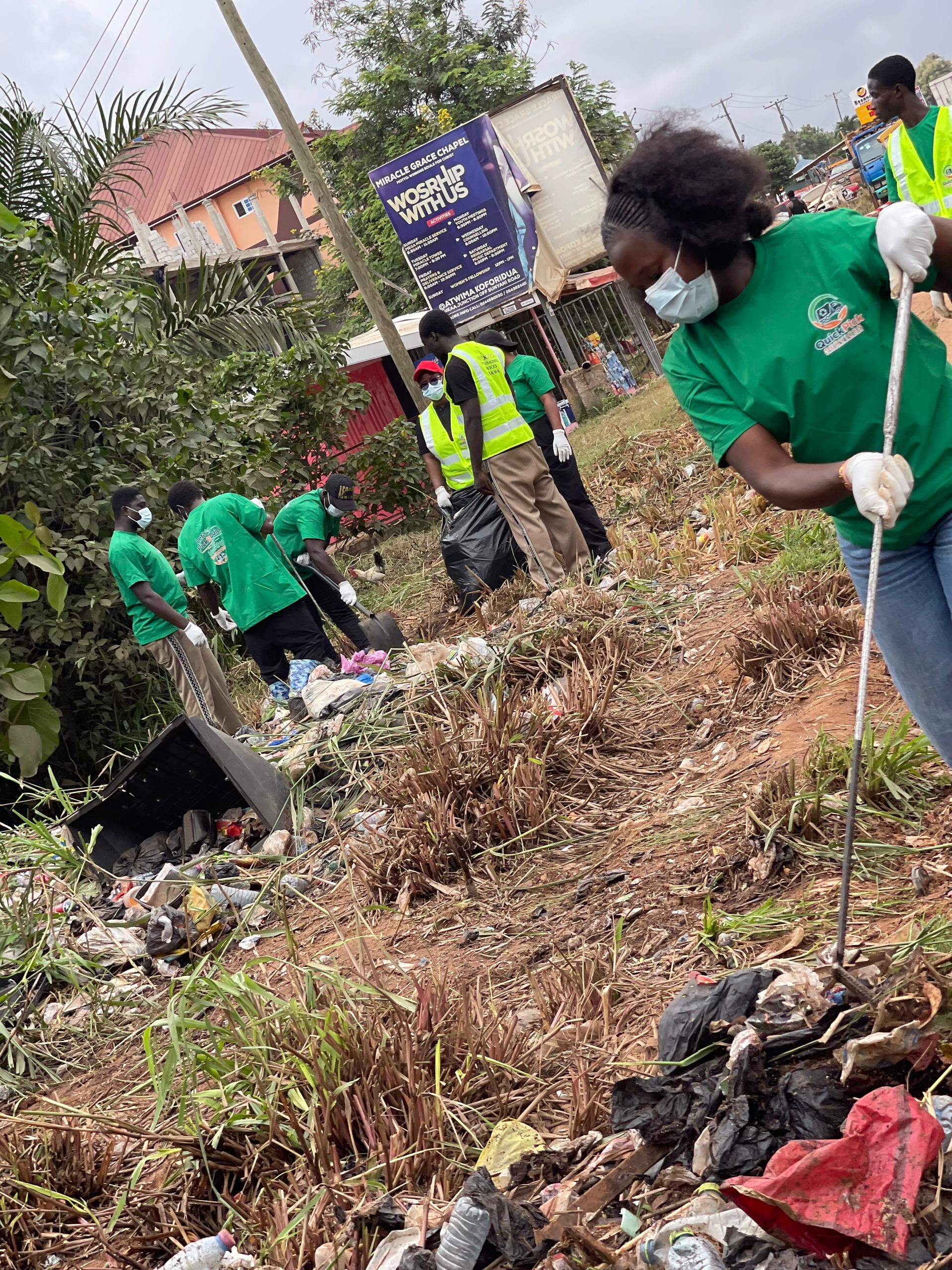 QuickPick team clearing a drain at Atwima Koforidua
