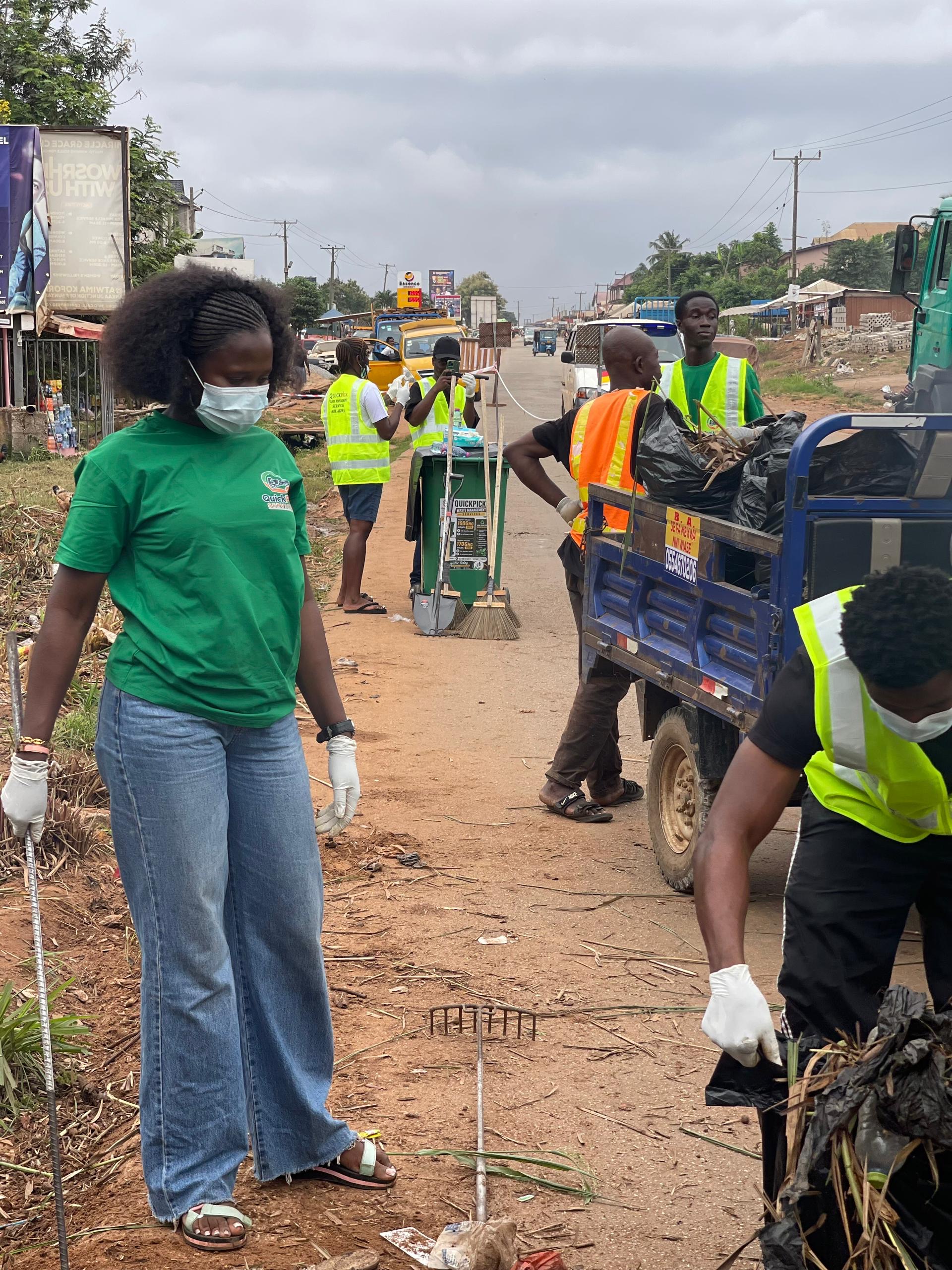 QuickPick team and collection tricycle at a roadside clean-up